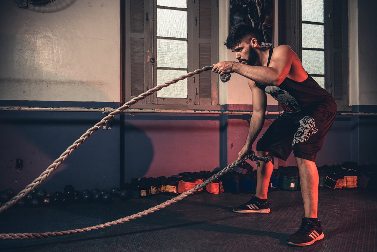 Man Holding Brown Rope